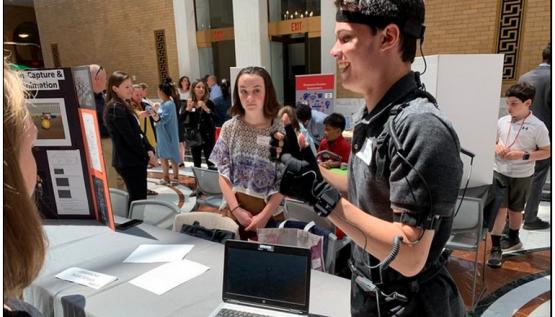 A student from Pembroke High School in Massachusetts wears the Perception Neuron motion capture suit. 